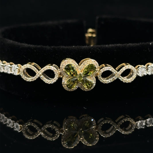 Yellow gold and Diamond Butterfly & Infinity bracelet with Multicolored Red Stones.