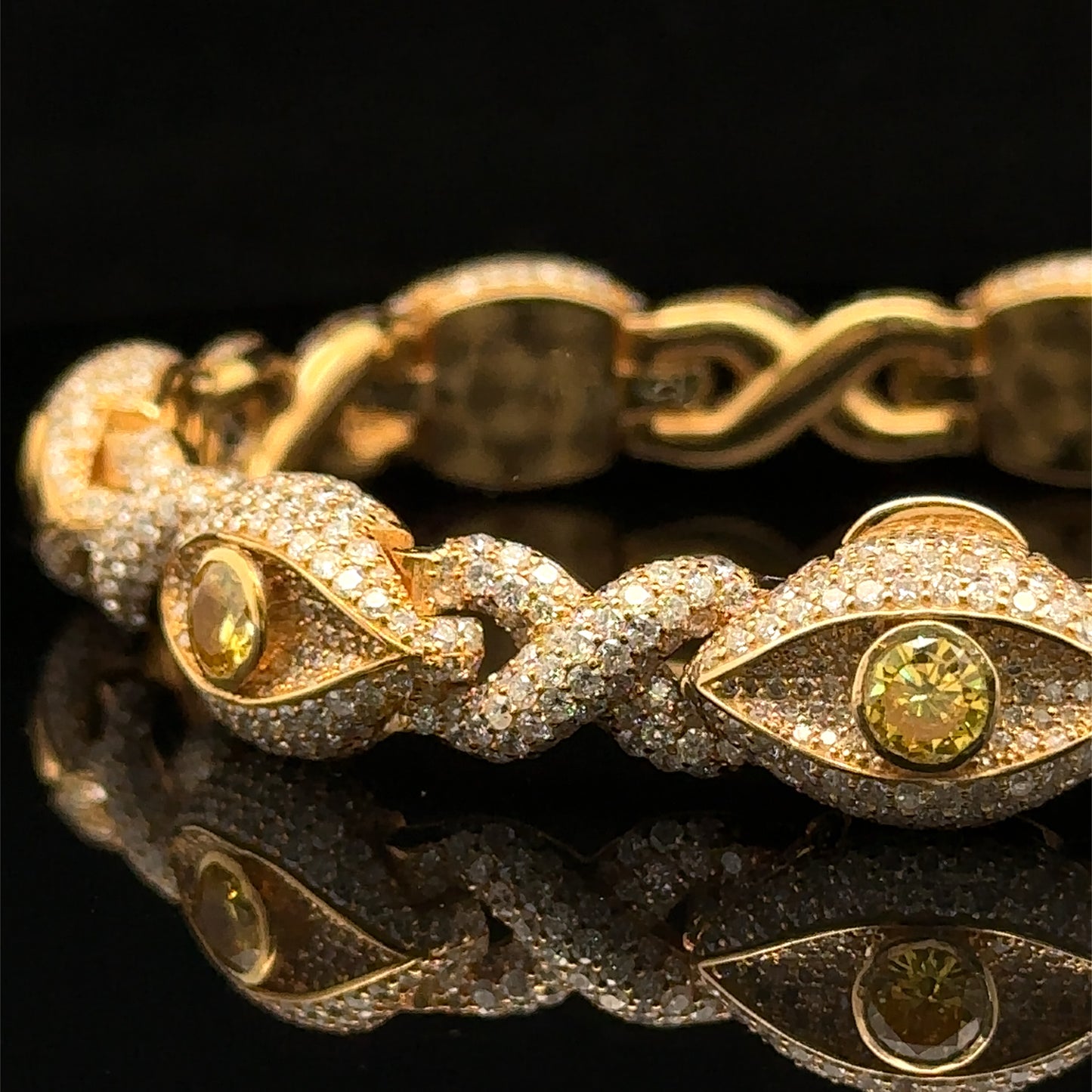 Yellow Gold and Diamond Evil Eye Bracelet with round diamonds and yellow stones