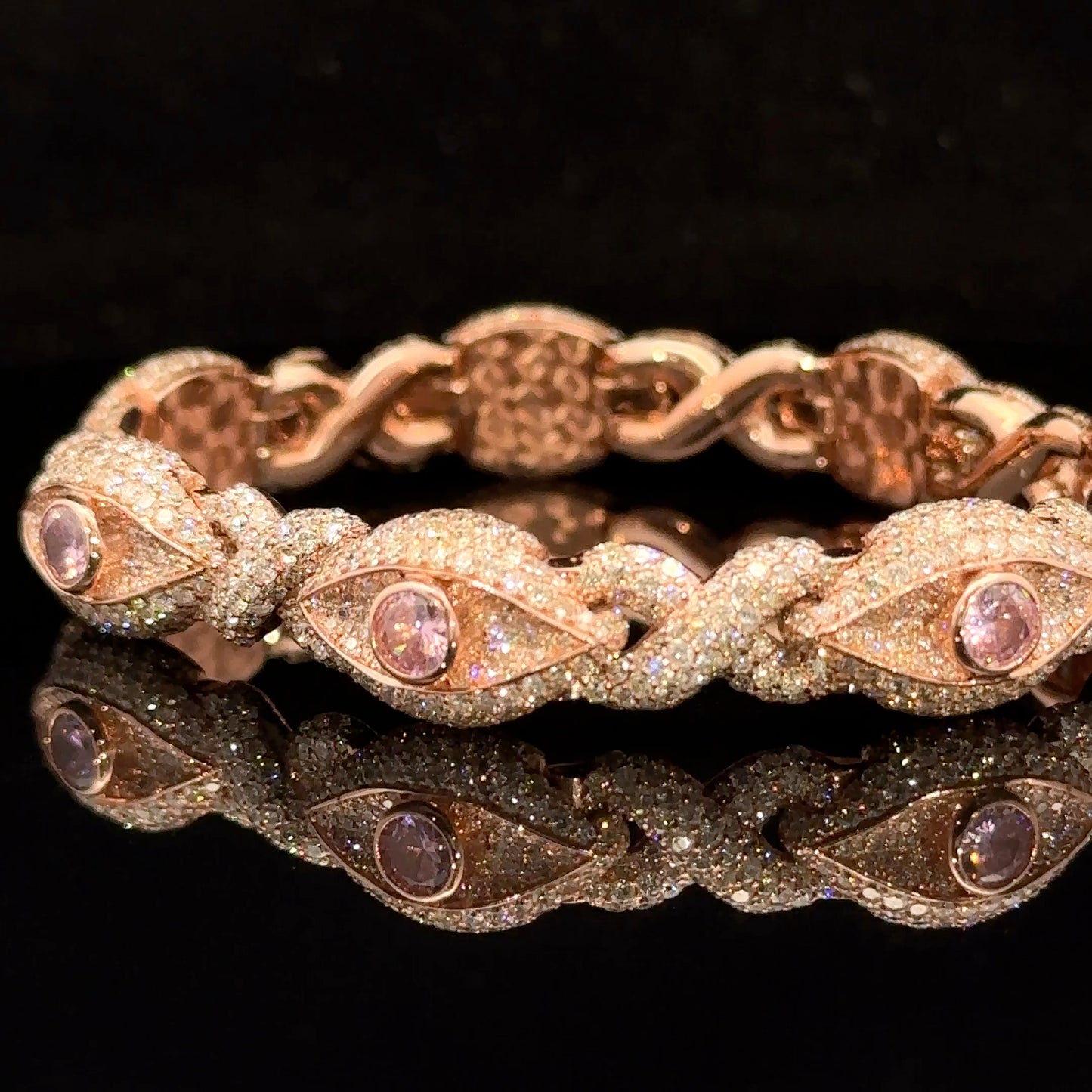 Rose Gold and Diamond Evil Eye Bracelet with round diamonds and pink stones