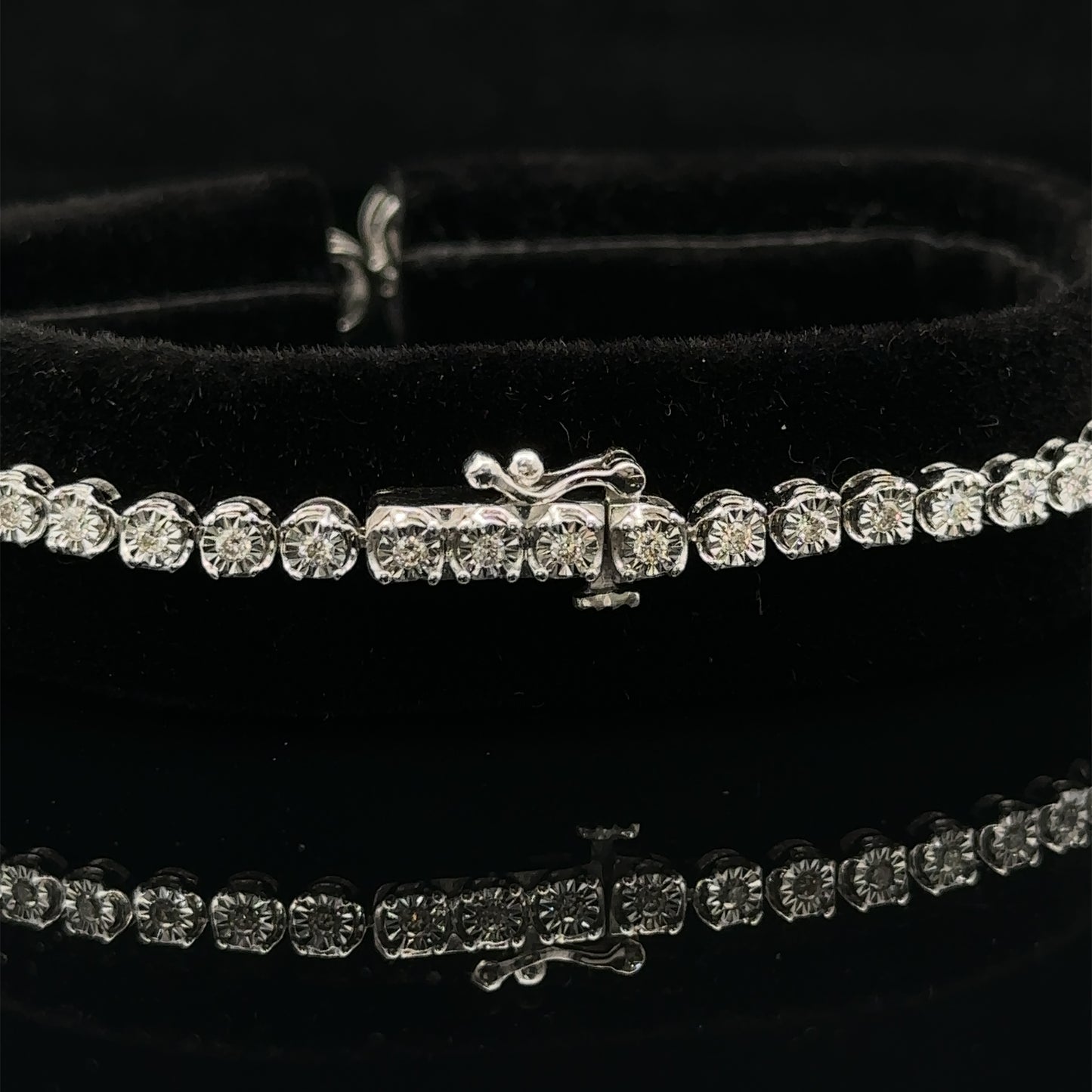 White gold and Diamond Butterfly & Infinity bracelet with Multicolored Red Stones.