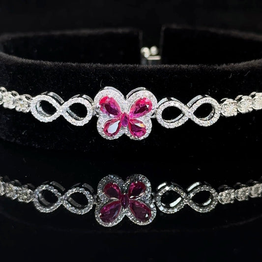 White  gold and Diamond Butterfly & Infinity bracelet with Multicolored Red Stones.