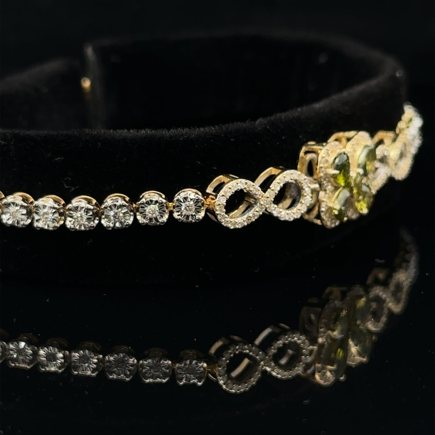 Yellow gold and Diamond Butterfly & Infinity bracelet with Multicolored Red Stones.
