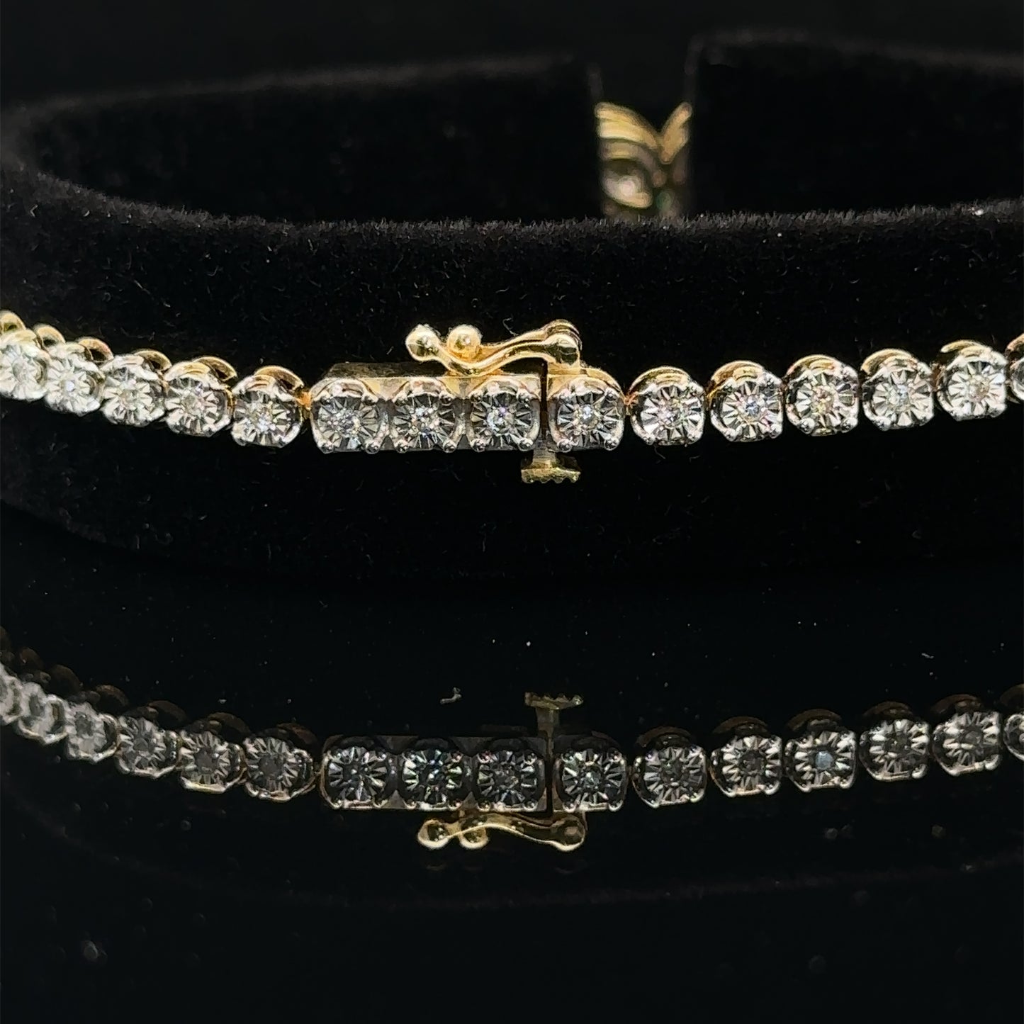 Yellow gold and Diamond Butterfly & Infinity bracelet with Multicolored Red Stones.