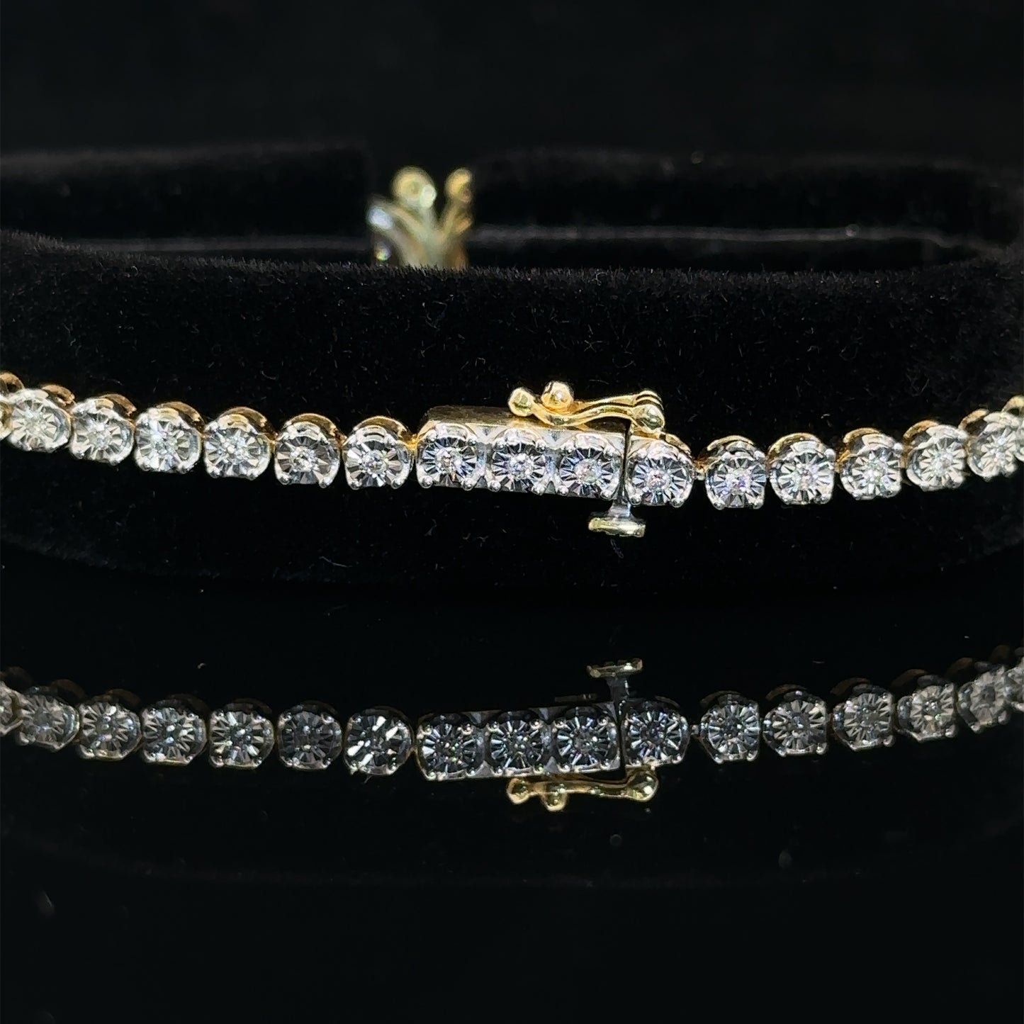 yellow gold and diamond Tennis Bracelet with butterfly insignia and Multicolored Stones