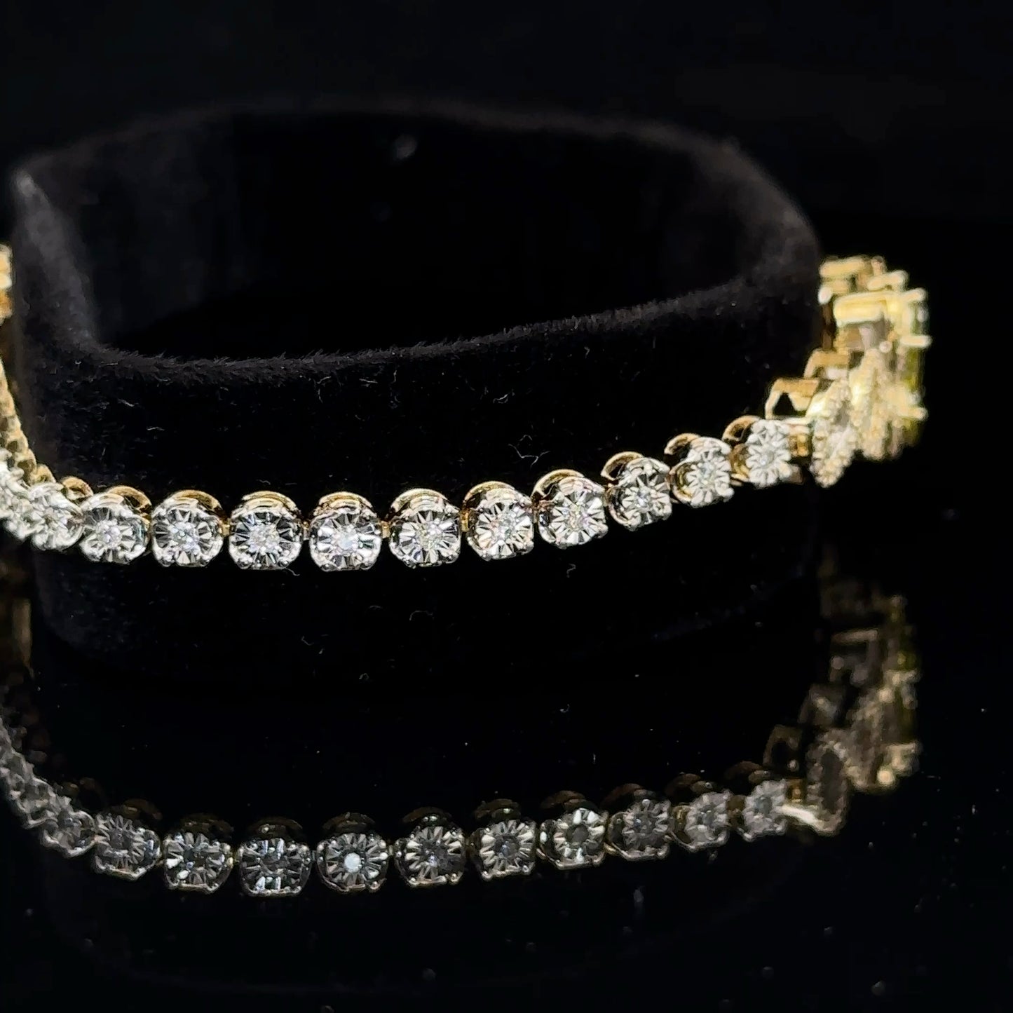 Yellow gold and Diamond Butterfly & Infinity bracelet with Multicolored Red Stones.