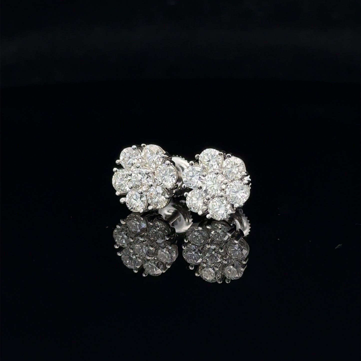 14k white gold and diamond flower Earrings (14 pointer)