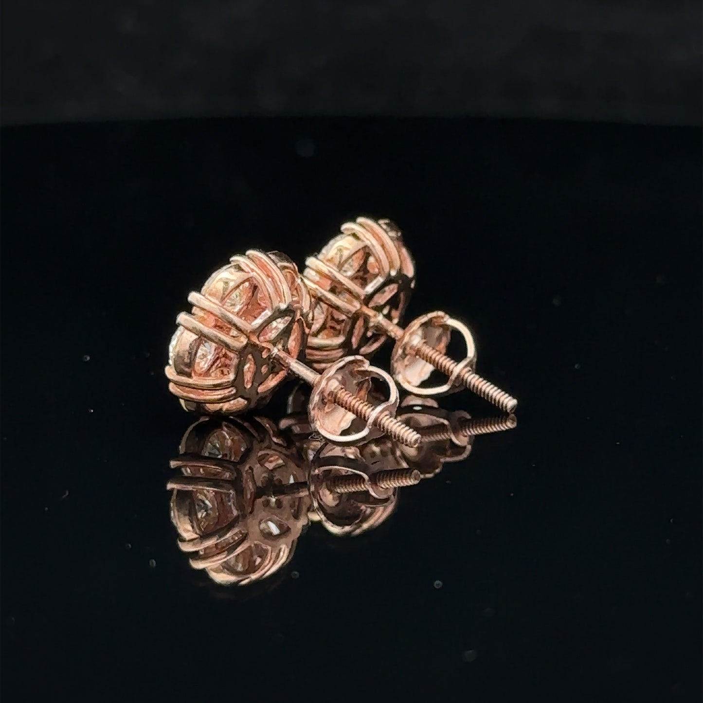 14k rose gold and diamond flower Earrings (18 pointer)