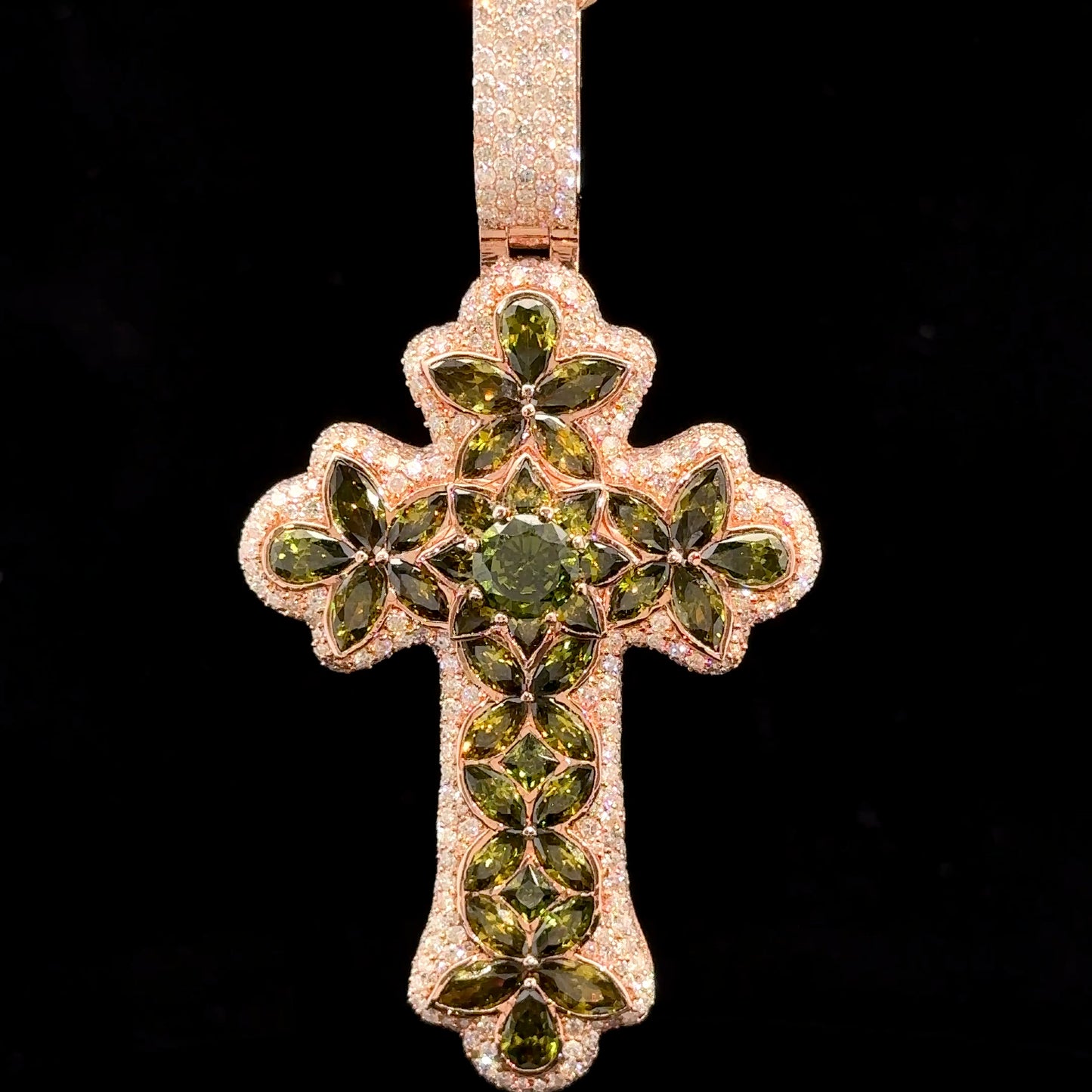 Rose gold and 7.55ct diamond Cross Pendant with round diamonds and green stones.