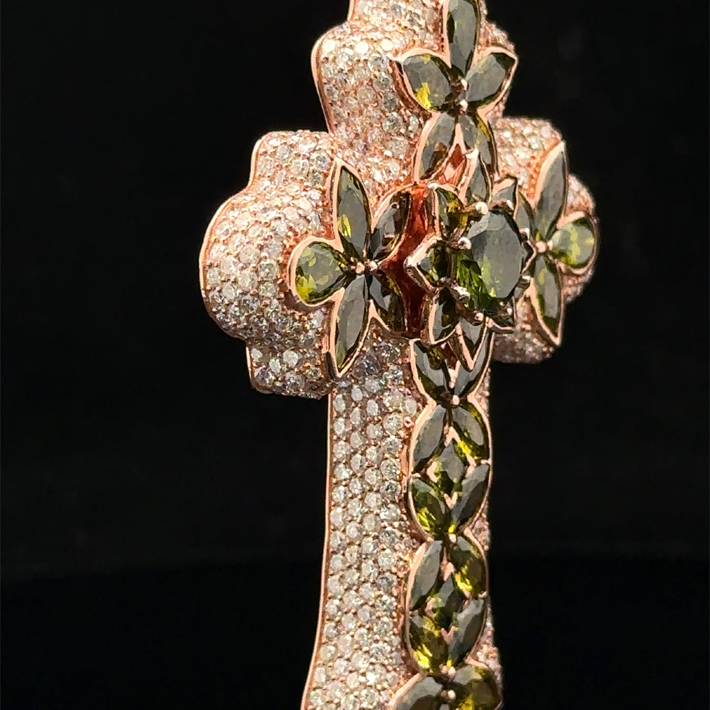 Rose gold and 7.55ct diamond Cross Pendant with round diamonds and green stones.