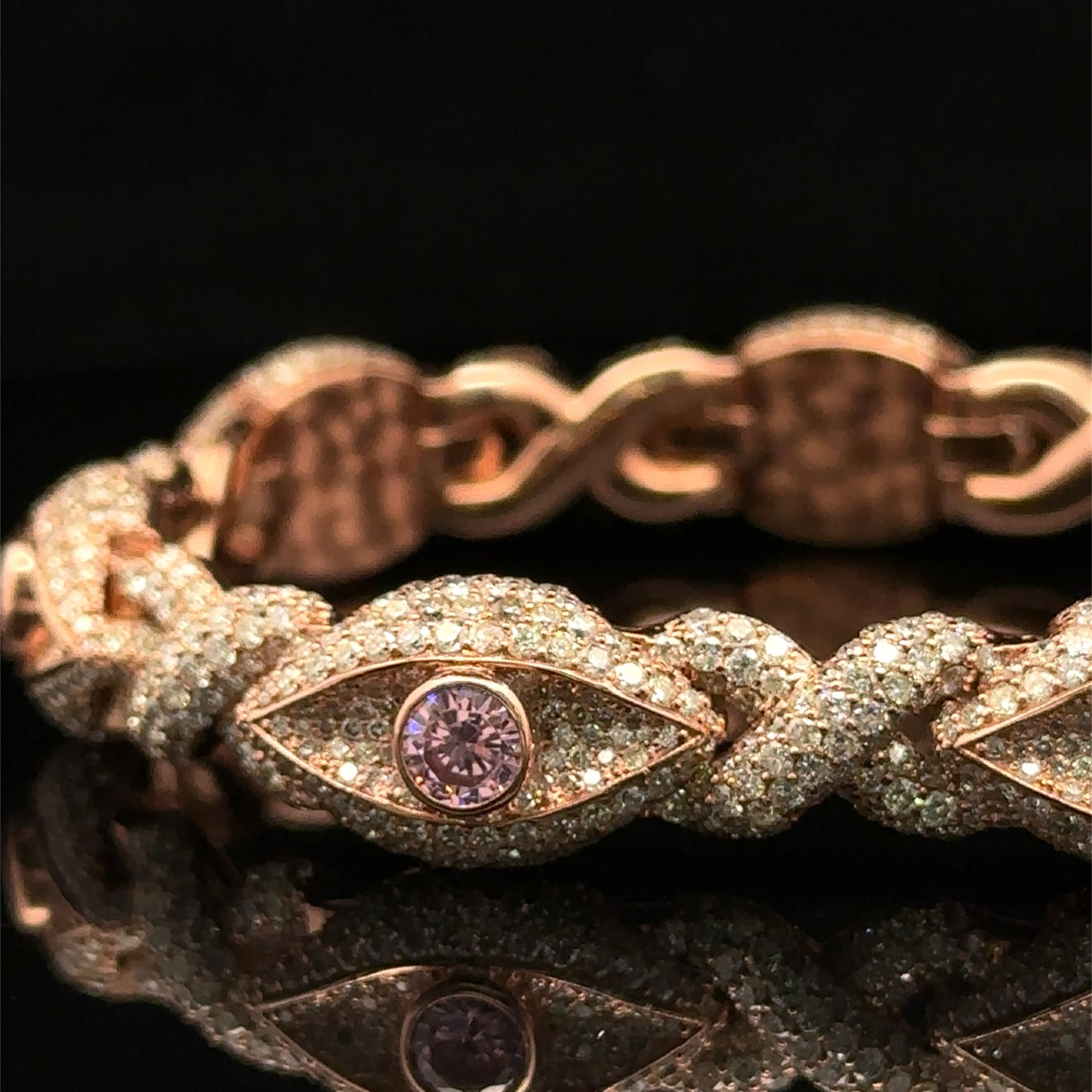 Rose Gold and Diamond Evil Eye Bracelet with round diamonds and pink stones