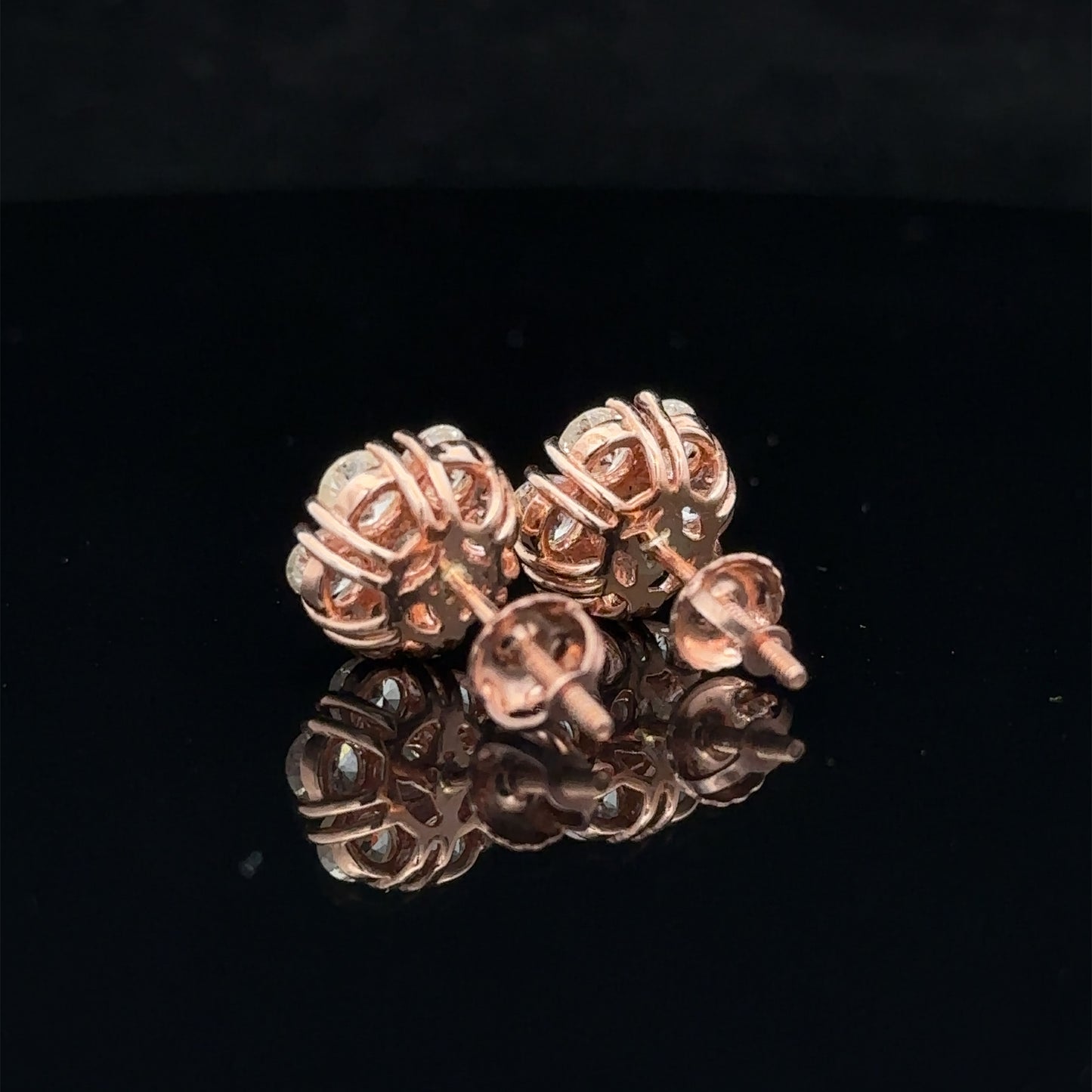 14k rose gold and diamond flower Earrings (15 pointer)