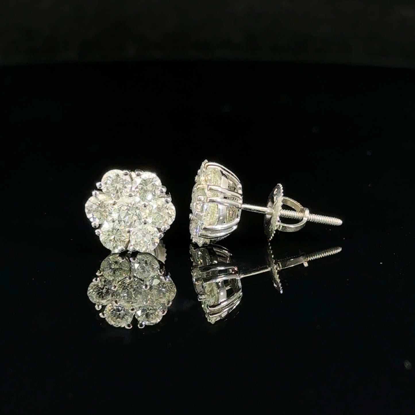 14k white gold and diamond flower Earrings (12 pointer)