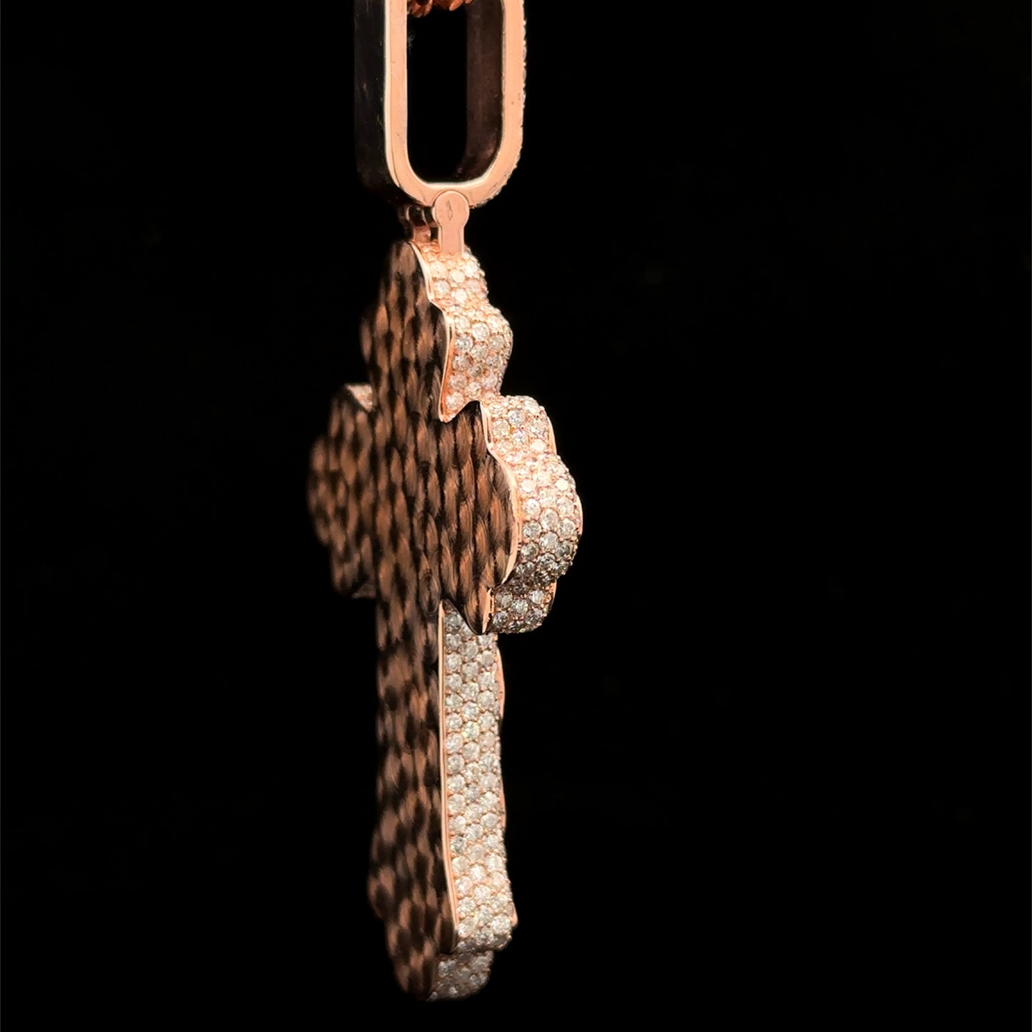 Rose gold and 7.55ct diamond Cross Pendant with round diamonds and green stones.