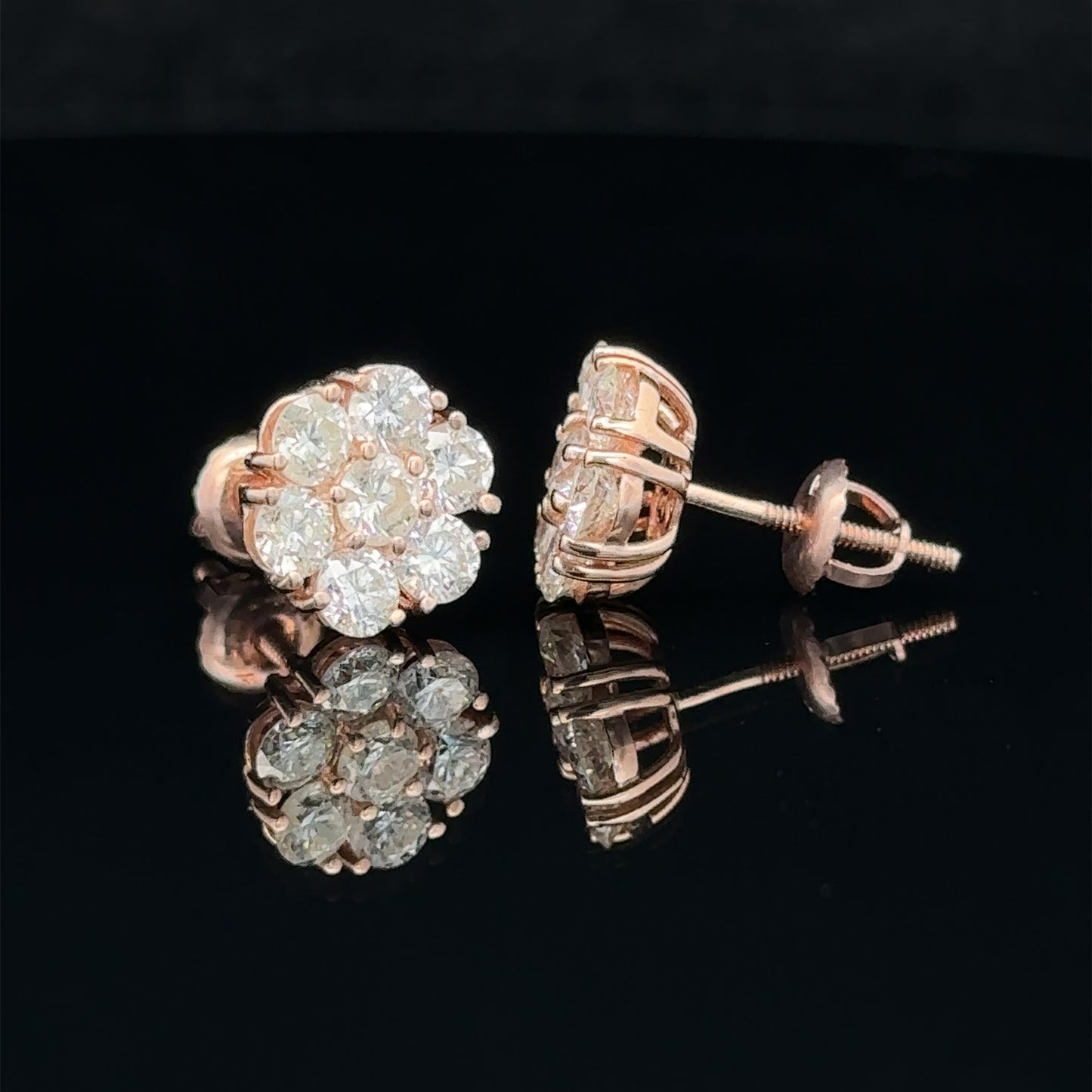 14k rose gold and diamond flower Earrings (15 pointer)