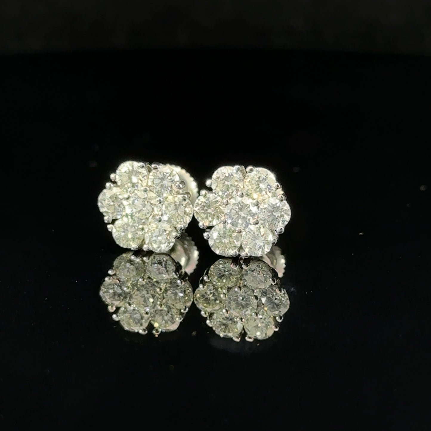 14k white gold and diamond flower Earrings (12 pointer)