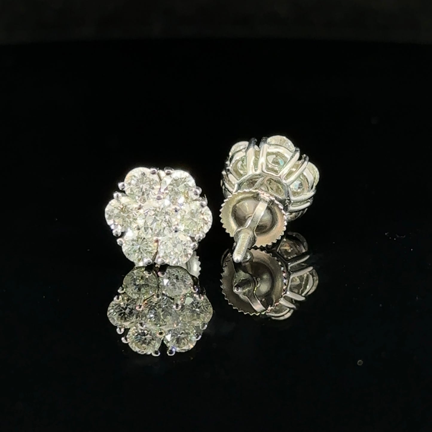 14k white gold and diamond flower Earrings (12 pointer)