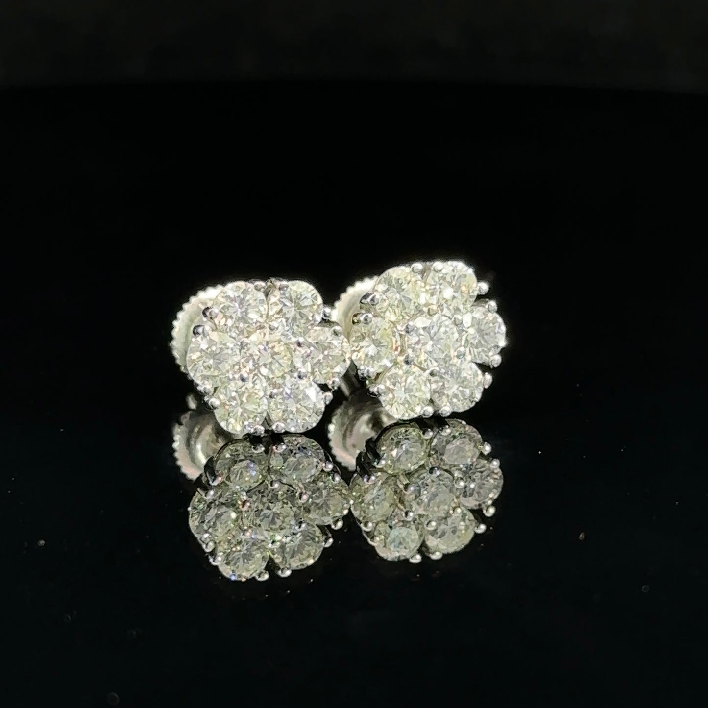 14k white gold and diamond flower Earrings (12 pointer)