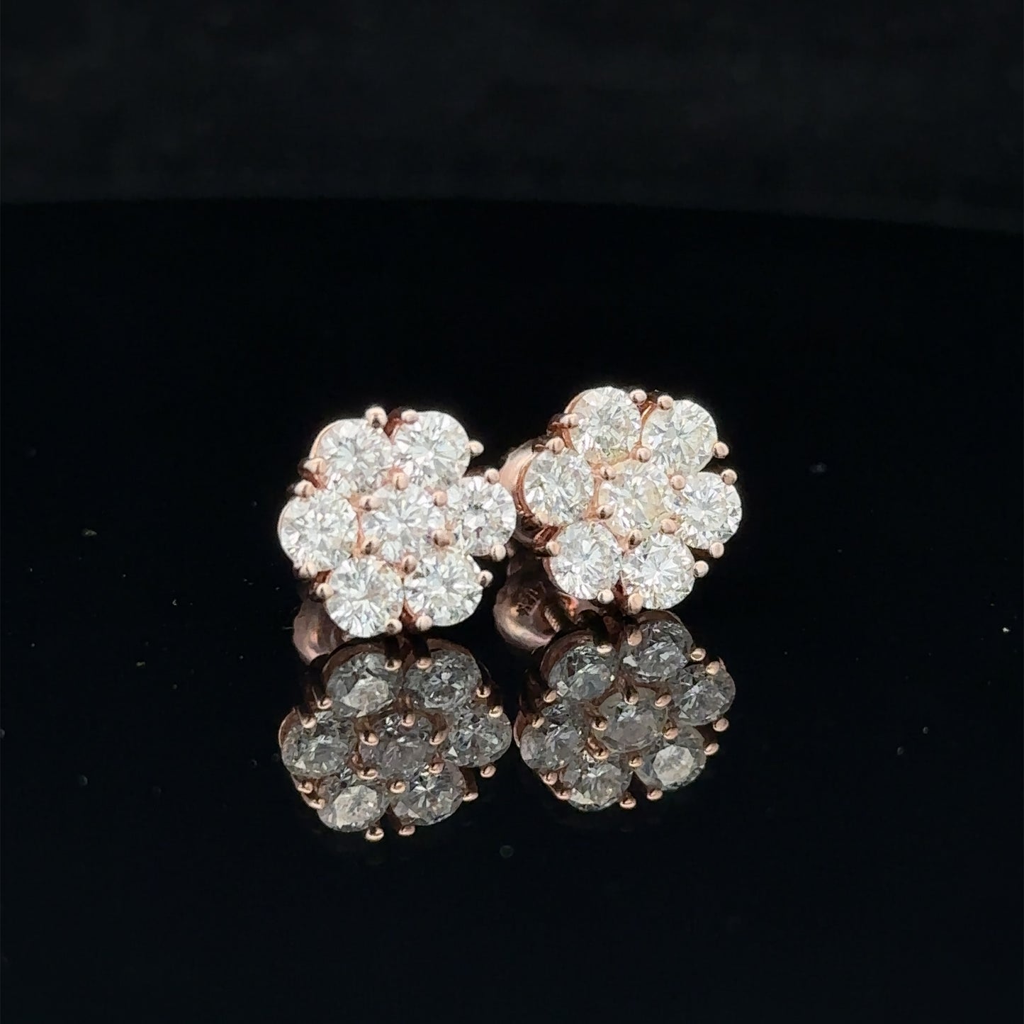 14k rose gold and diamond flower Earrings (15 pointer)