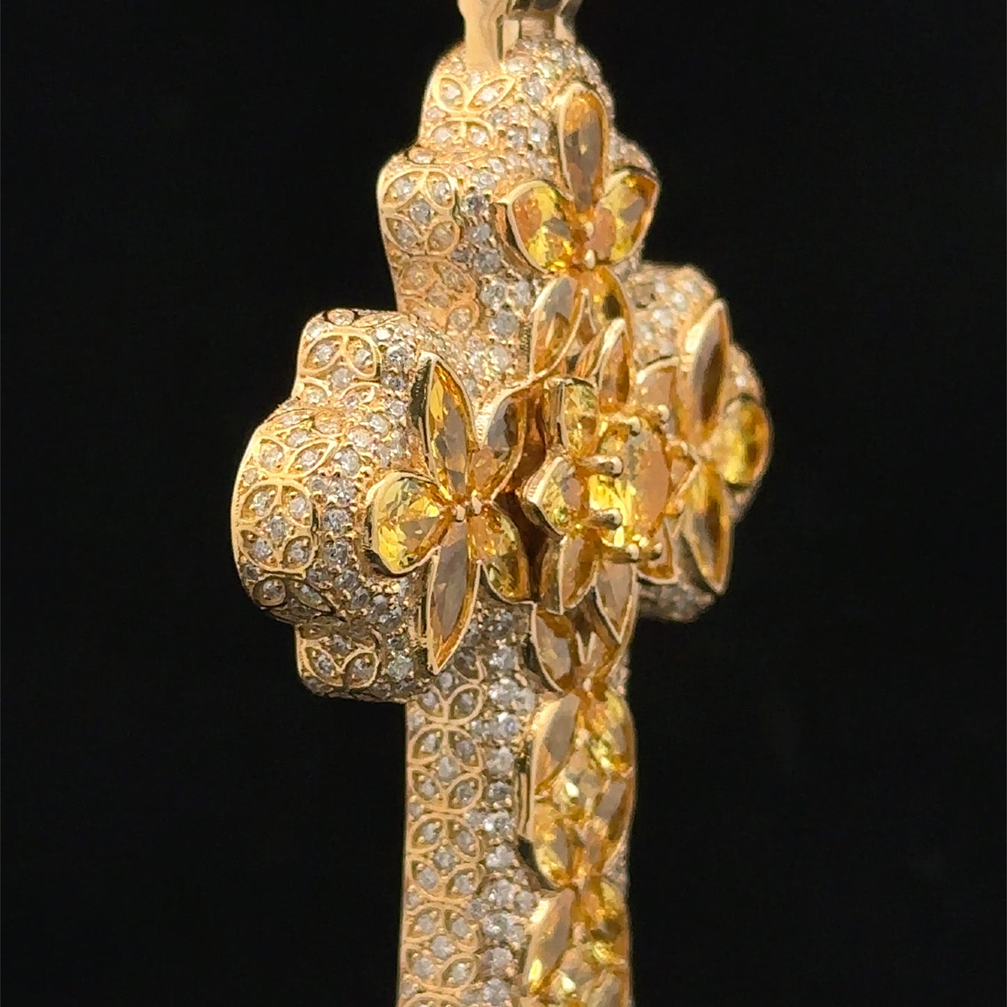14k yellow gold and 5ct diamond Cross Pendant with round diamonds and yellow stones.