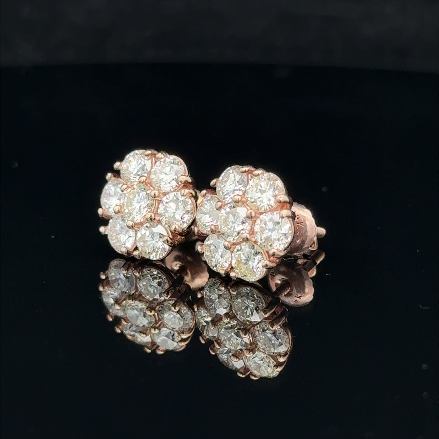 14k rose gold and diamond flower Earrings (18 pointer)