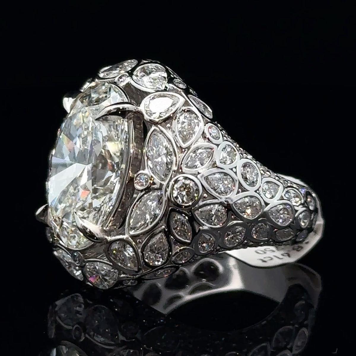 White Gold and Fancy Cut Diamond Ring With Oval Center