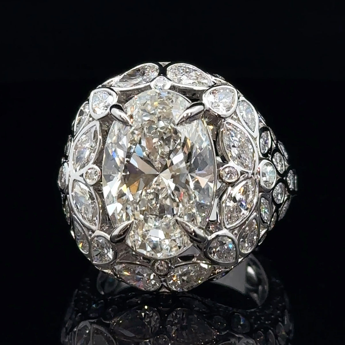 White Gold and Fancy Cut Diamond Ring With Oval Center