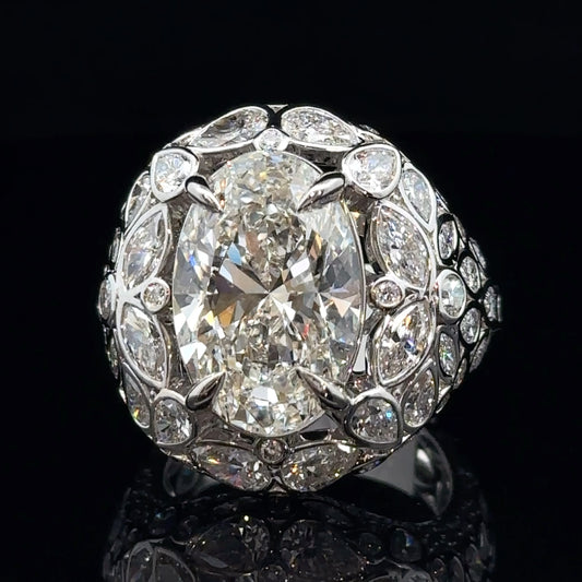 White Gold and Fancy Cut Diamond Ring With Oval Center